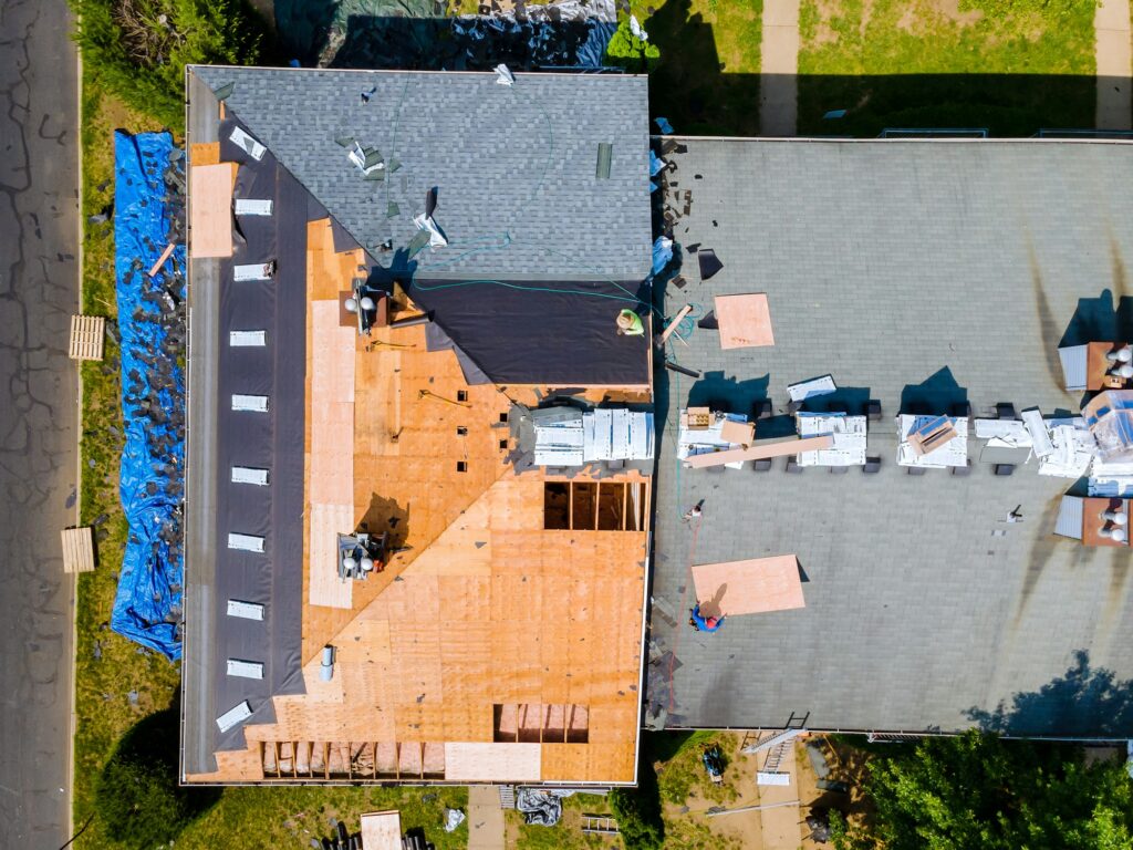 An apartment building roof was repaired by replacing old roof with new shingles